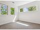 Bright bedroom with three windows, carpeted floors, and natural light, perfect for rest and relaxation at 1911 S Lafayette St, Denver, CO 80210