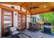 Covered deck featuring wood ceiling, ceiling fan, and outdoor dining set, perfect for entertaining at 1911 S Lafayette St, Denver, CO 80210
