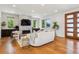 Cozy living room features a stone fireplace, large windows, and ample seating at 1911 S Lafayette St, Denver, CO 80210