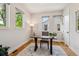 Bright office space with hardwood floors, white walls, and natural light from three windows at 1911 S Lafayette St, Denver, CO 80210