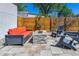 Stylish patio with a comfortable sofa, modern chairs, and a stone fire pit, great for outdoor relaxation at 1911 S Lafayette St, Denver, CO 80210