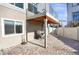 Private patio area with brick pavers, open space, and a covered outdoor area perfect for entertaining at 17938 E 54Th Ave, Denver, CO 80249