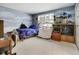 Nicely decorated bedroom with a unique paint job and plenty of light at 6005 S Jamaica Way, Englewood, CO 80111