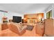 Relaxing living room with a stone fireplace, comfortable seating, and ample space at 6005 S Jamaica Way, Englewood, CO 80111