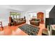 Spacious living room featuring wood floors, comfortable seating, and stylish decor at 6005 S Jamaica Way, Englewood, CO 80111