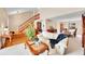 Cozy living room with a staircase, neutral decor, and comfortable seating at 6005 S Jamaica Way, Englewood, CO 80111