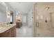 Elegant bathroom showcasing a marble vanity, glass-enclosed shower, and stylish finishes at 425 Monroe St, Denver, CO 80206