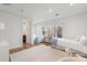 Spacious bedroom with two beds, hardwood floors, and large windows at 425 Monroe St, Denver, CO 80206