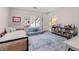 Bright bedroom with a built in daybed, shelving and patterned rug at 425 Monroe St, Denver, CO 80206