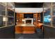 Executive home office with custom built-ins and wood paneled fireplace at 425 Monroe St, Denver, CO 80206