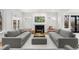Bright living room featuring a fireplace, comfortable seating, and French doors leading to the outdoors at 425 Monroe St, Denver, CO 80206