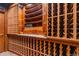 Custom built wine cellar with wood racks and stone countertops at 425 Monroe St, Denver, CO 80206