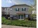 Inviting townhome exterior showcasing dark green shutters and well-maintained landscaping at 4582 W Alameda Ave, Denver, CO 80219