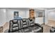 A basement theater room with leather seating, a pool table, and a bar at 7183 S Poplar St, Centennial, CO 80112