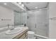 Bathroom with a large frosted glass shower, a mirror, and a light-colored vanity at 7183 S Poplar St, Centennial, CO 80112