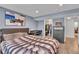 Comfortable bedroom with hardwood floors, walk-in closet, and stylish decor at 7183 S Poplar St, Centennial, CO 80112