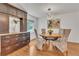 Elegant dining room featuring hardwood floors, stylish lighting, and a decorative cabinet, perfect for formal gatherings at 7183 S Poplar St, Centennial, CO 80112