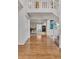 Bright foyer boasts hardwood floors, staircase, and an open view to the living space, creating a welcoming atmosphere at 7183 S Poplar St, Centennial, CO 80112