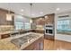 Beautiful kitchen featuring granite countertops, stainless steel appliances, and custom cabinetry, perfect for cooking and entertaining at 7183 S Poplar St, Centennial, CO 80112