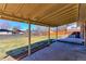 Spacious covered patio overlooking a large grassy backyard, perfect for outdoor entertaining and relaxation at 383 S 21St Ave, Brighton, CO 80601
