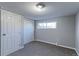 Comfortable bedroom with plush carpeting, double closets, a window for natural light, and neutral decor at 383 S 21St Ave, Brighton, CO 80601