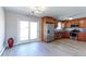 Bright and spacious kitchen boasts stainless steel appliances, wooden cabinets, and a sliding glass door at 383 S 21St Ave, Brighton, CO 80601