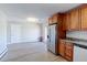 Open concept kitchen and dining area includes stainless steel appliances and light hard wood flooring at 383 S 21St Ave, Brighton, CO 80601