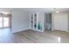 Spacious living room showcasing a built-in shelving unit and light hard wood flooring at 383 S 21St Ave, Brighton, CO 80601