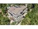 An aerial view showcasing the home's multi-level decks, balconies, and lush, surrounding trees at 1250 Dolan Dr, Monument, CO 80132