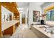 A luxurious bathroom featuring a soaking tub, skylights, and dual vanities at 1250 Dolan Dr, Monument, CO 80132