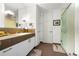 Well-lit bathroom featuring a double vanity, mosaic tile accents, and glass enclosed shower at 1250 Dolan Dr, Monument, CO 80132