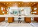 Unique bathroom features dual vanities, wood accents, and ample lighting at 1250 Dolan Dr, Monument, CO 80132