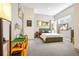 Bright bedroom with carpet, unique decor, and a comfortable-looking bed at 1250 Dolan Dr, Monument, CO 80132