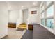 Bright entryway features custom bench seating, wood stairs, and large windows for natural light at 1250 Dolan Dr, Monument, CO 80132