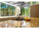 Modern kitchen featuring stainless steel appliances, granite countertops and large picture windows with wooded views at 1250 Dolan Dr, Monument, CO 80132