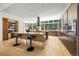 Open-concept kitchen with an oversized island, bar seating, and stainless steel appliances at 1250 Dolan Dr, Monument, CO 80132