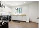 Spacious laundry room featuring modern washer and dryer and custom cabinetry at 1250 Dolan Dr, Monument, CO 80132