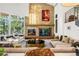 Comfortable living room features a modern fireplace and stone accents at 1250 Dolan Dr, Monument, CO 80132