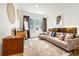 Bright living room with neutral tones, modern furniture, and large windows at 1250 Dolan Dr, Monument, CO 80132