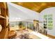 Open loft with wood floors, custom railings, and a beautiful view of the surrounding landscape at 1250 Dolan Dr, Monument, CO 80132