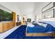 Bright main bedroom with a fireplace, blue carpet, and modern decor at 1250 Dolan Dr, Monument, CO 80132
