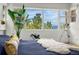Bright main bedroom with a view of the mountains and forest at 1250 Dolan Dr, Monument, CO 80132