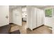 Mud room features storage lockers, bench seating, tiled floors, and convenient laundry access at 1250 Dolan Dr, Monument, CO 80132