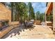Enjoy outdoor living on this stone patio with a built-in grill and fireplace at 1250 Dolan Dr, Monument, CO 80132