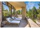 Covered patio featuring comfortable lounge chairs and beautiful views at 1250 Dolan Dr, Monument, CO 80132