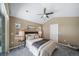 Spacious bedroom with neutral decor, ceiling fan, and ample natural light at 8626 Gold Peak Dr # B, Highlands Ranch, CO 80130