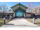 Inviting building entrance featuring modern architectural design and a covered walkway at 8626 Gold Peak Dr # B, Highlands Ranch, CO 80130