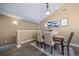 Cozy dining area with hardwood floors and stylish wall art at 8626 Gold Peak Dr # B, Highlands Ranch, CO 80130