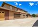 Long shot of the garages and a partial view of the upstairs patio at 8626 Gold Peak Dr # B, Highlands Ranch, CO 80130