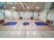 Spacious gymnasium with hardwood floors, basketball hoops, and ample space for various activities at 8626 Gold Peak Dr # B, Highlands Ranch, CO 80130